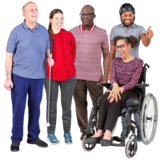 A group of five people. One person is holding a white cane and one person is using a wheelchair.