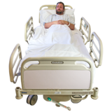 A man in a hospital bed.