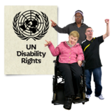  Three disabled people pointing to an image of the United Nations Convention on the Rights of Persons with Disabilities.