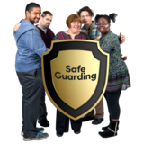 A group of people gathered together behind a big shield with the word 'Safeguarding' on it.