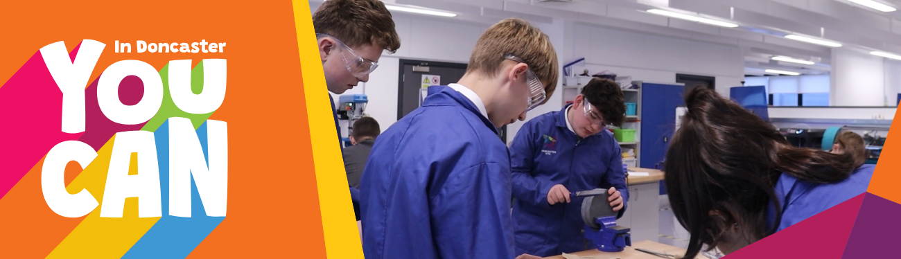 Students wearing safety specs in a workshop setting